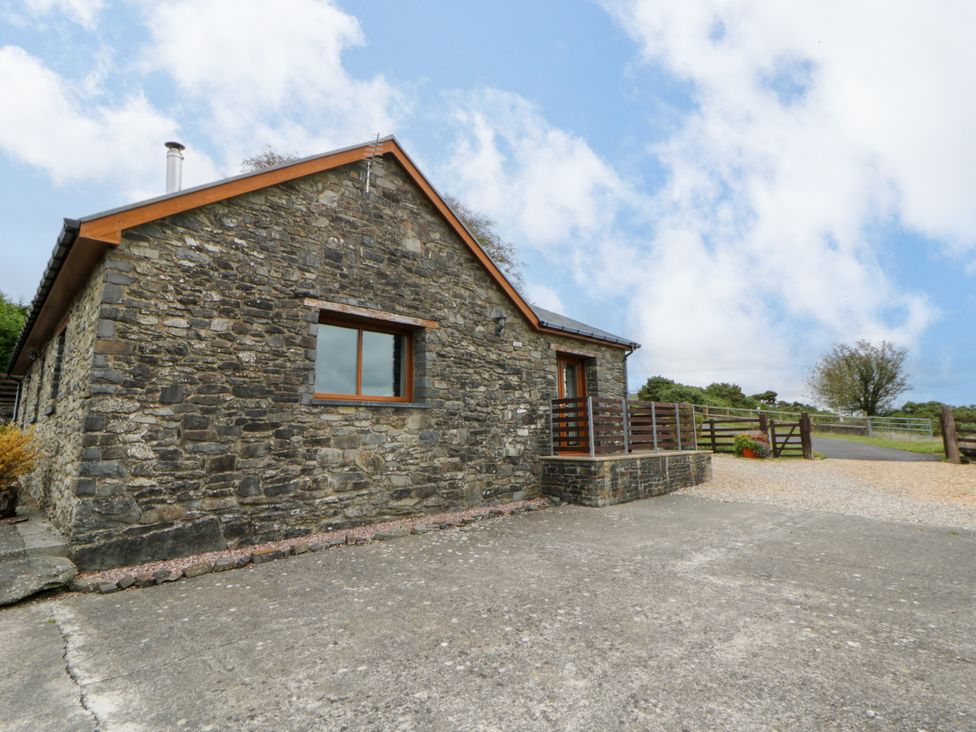 A stone building with a door and window at Y Bwthyn, Swyddffynnon near Pontrhydfendigaid