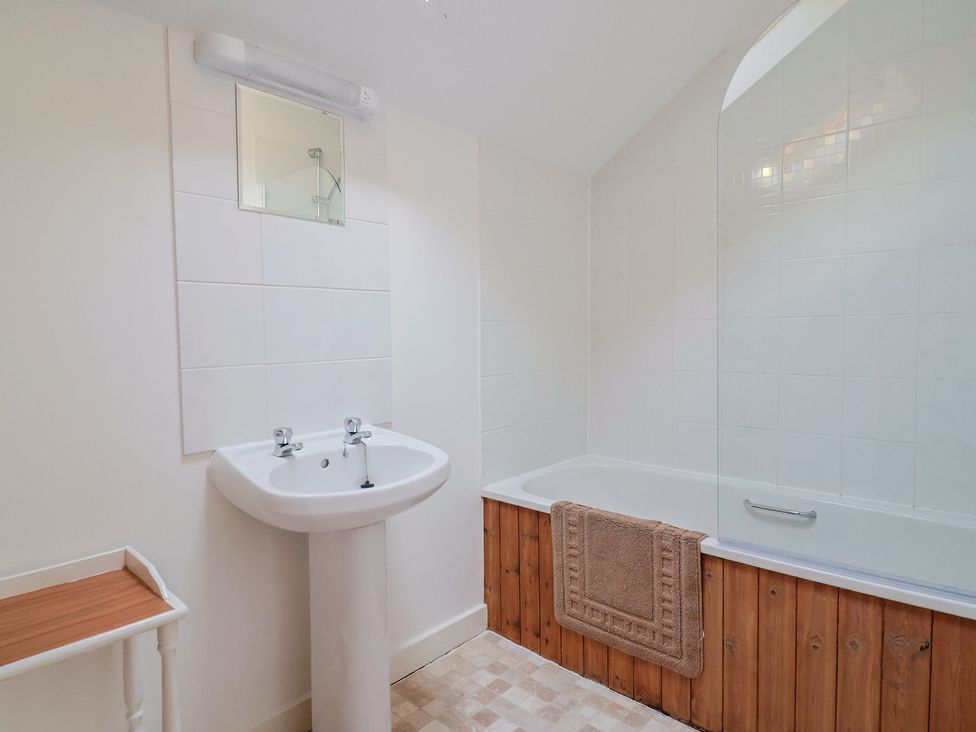 A bathroom with a sink and bathtub at West Bowden Farm Knowstone near South Molton