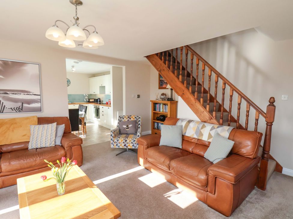 A living room with a sofa and coffee table at Heather Croft in Robin Hood's Bay