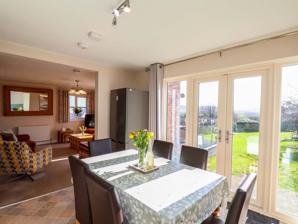 A dining room with a table and chairs at Heather Croft in Robin Hood's Bay