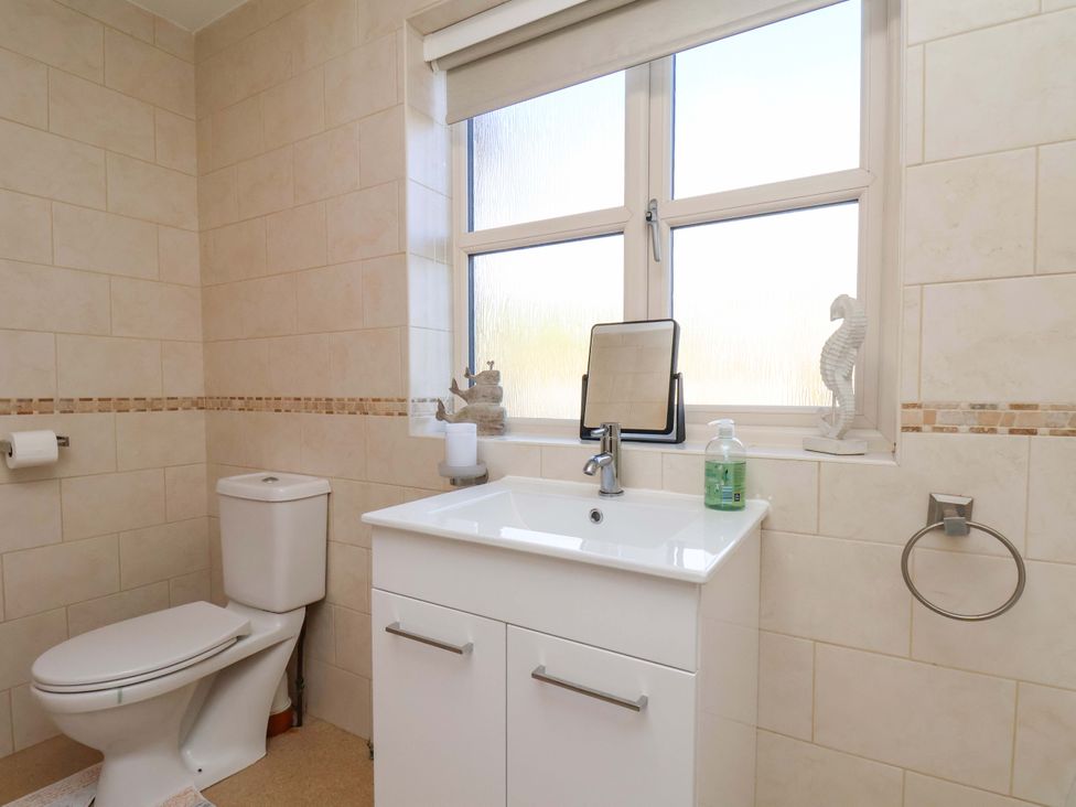 A bathroom with a sink and toilet at Heather Croft in Robin Hood's Bay
