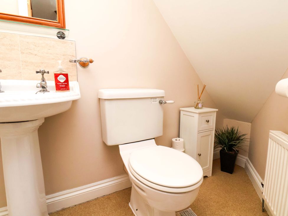 A bathroom with a toilet and sink at Heather Croft in Robin Hood's Bay