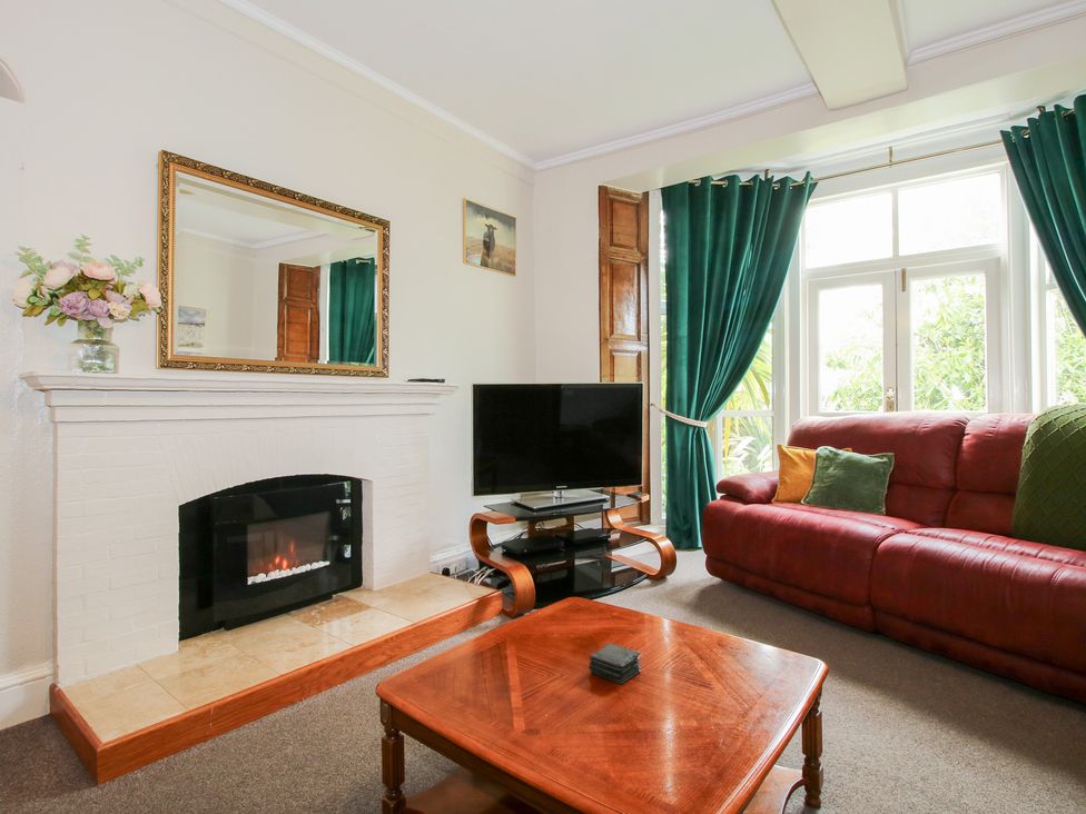 A living room with a sofa and television at The Laurels in Bishop's Castle