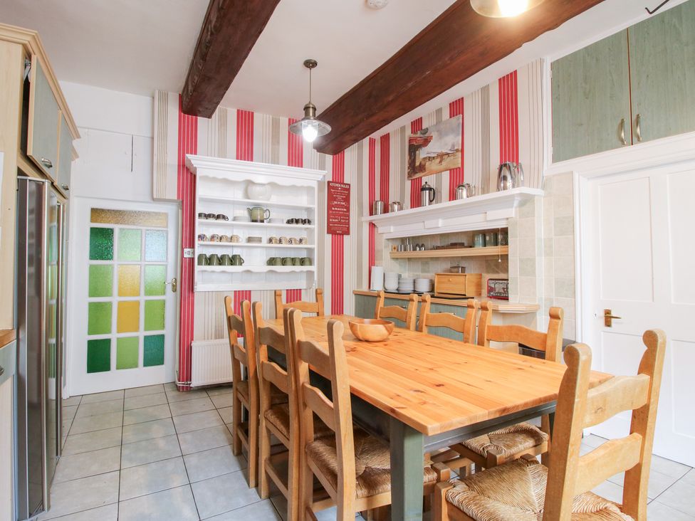 A kitchen with a dining table and chairs at The Laurels in Bishop's Castle