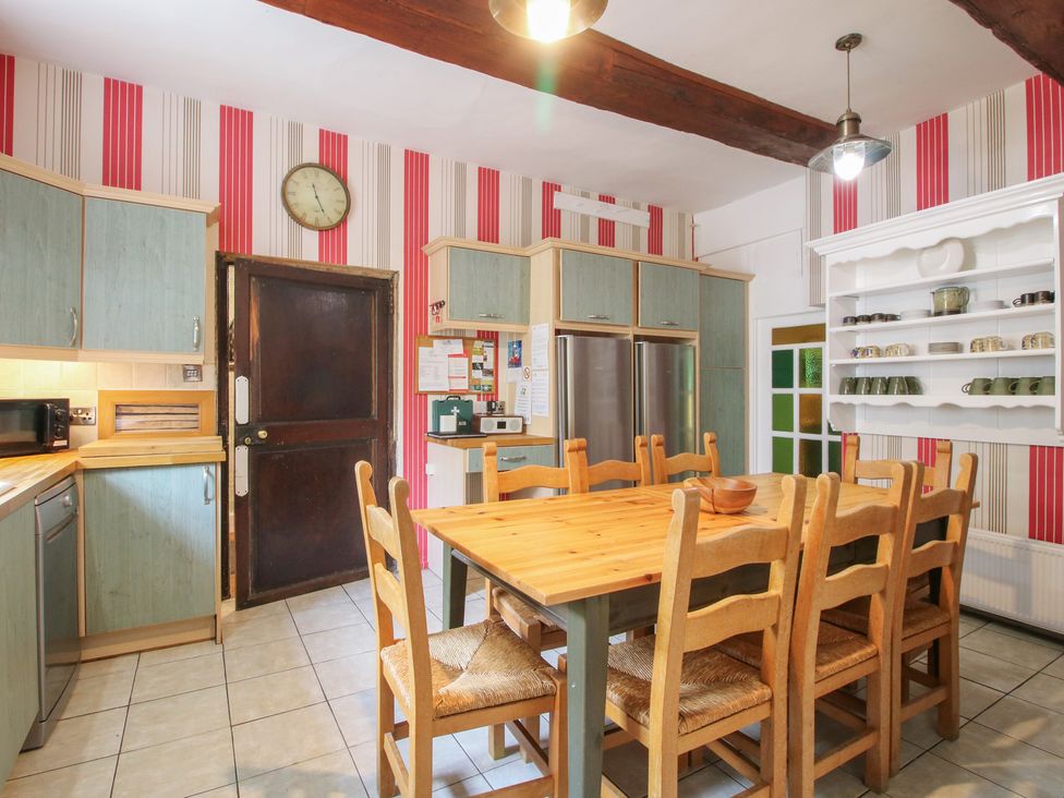 A kitchen with a table and chairs at The Laurels in Bishop's Castle