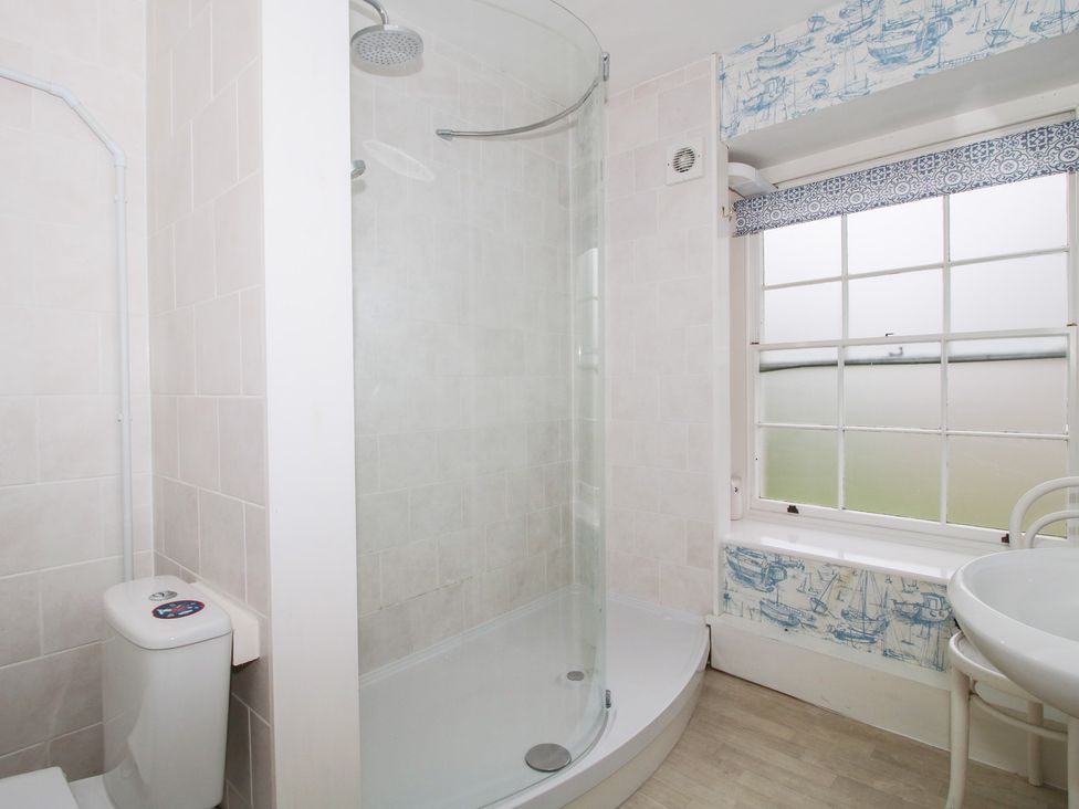 A bathroom with a shower, toilet, and sink at The Laurels in Bishop's Castle