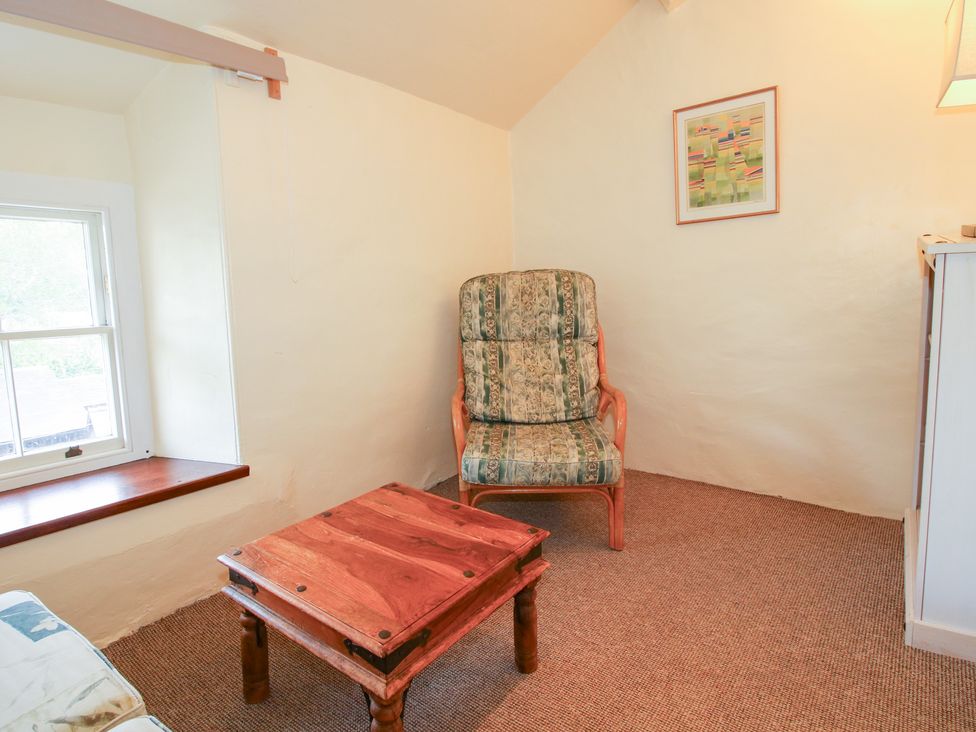 A snug with a chair and table at The Laurels in Bishop's Castle