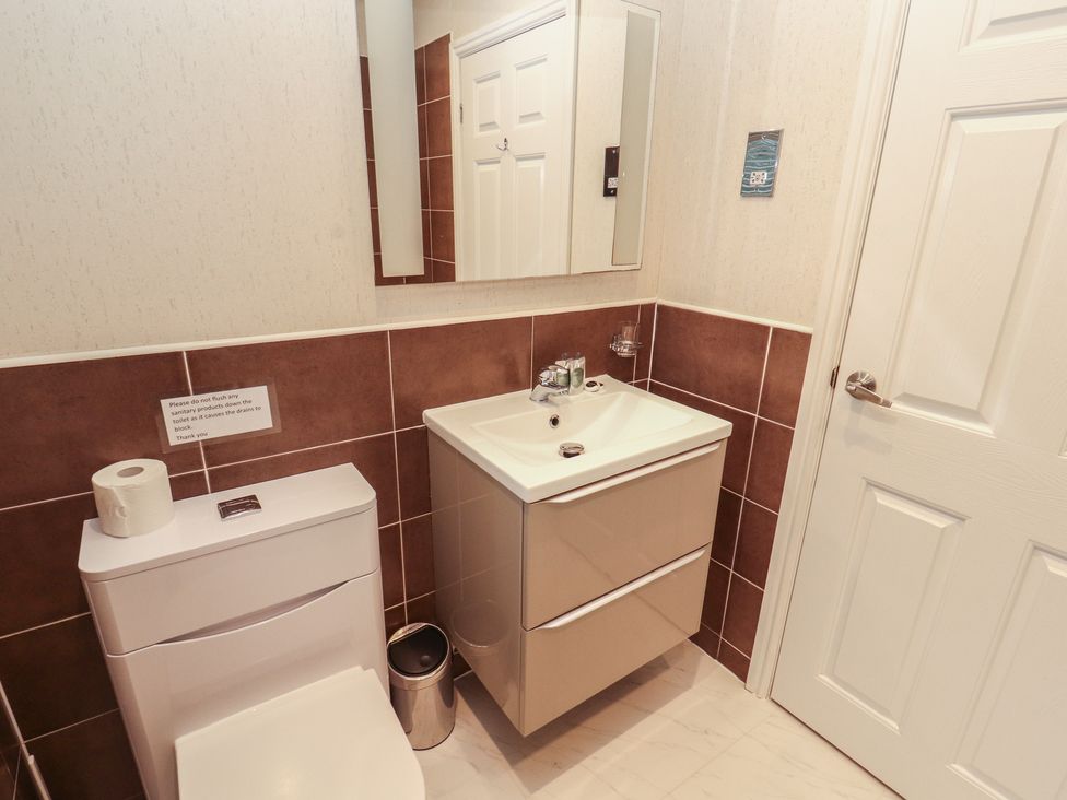 A bathroom with a sink and toilet at Beech Hill Lodge (Beech Hill 9) at Fallbarrow Park, Bowness-on-Windermere