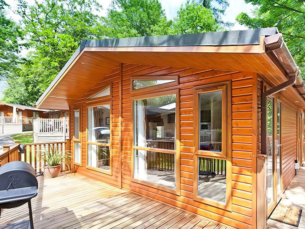 A log cabin with deck and grill at Beech Hill Lodge (Beech Hill 9) at Fallbarrow Park