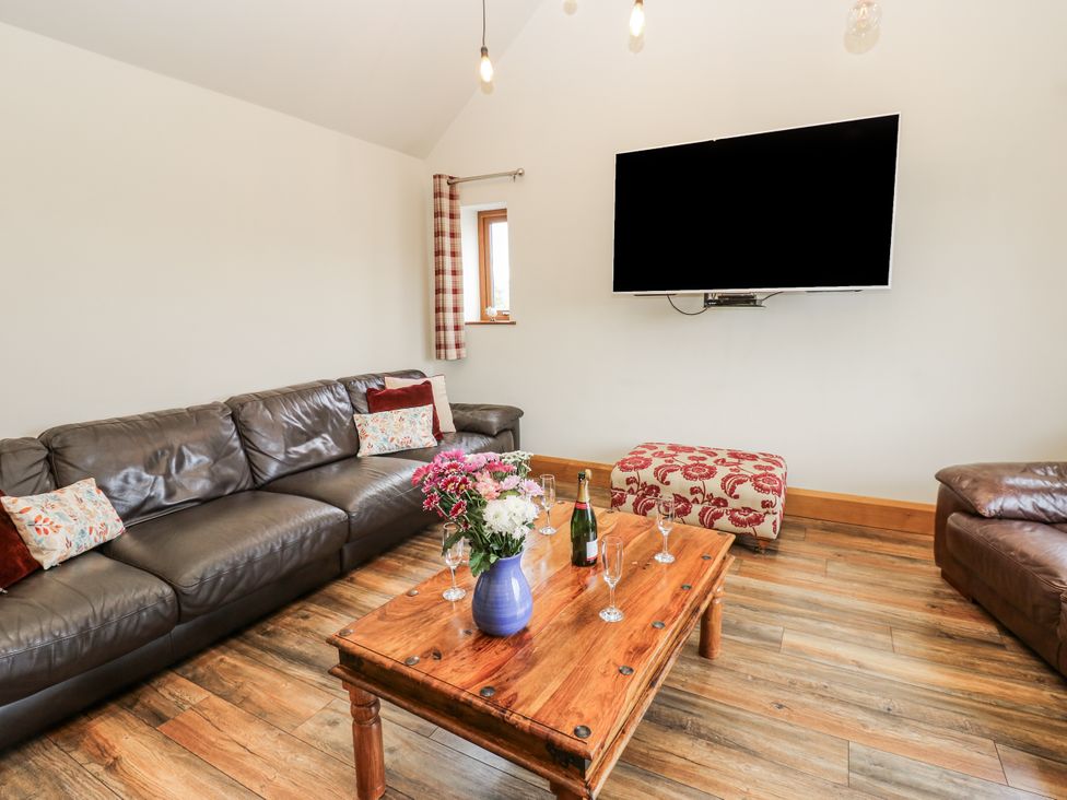 A living room with a sofa and coffee table at Jacob's Lodge in Eggleston