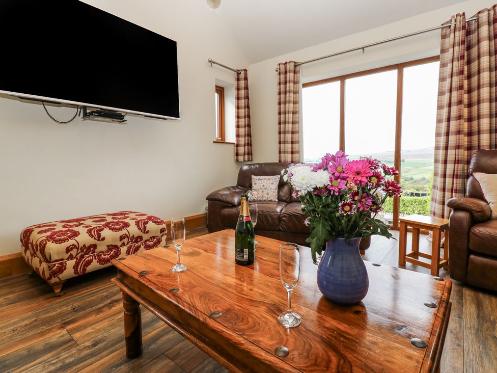 A living room with a sofa and coffee table at Jacob's Lodge in Eggleston
