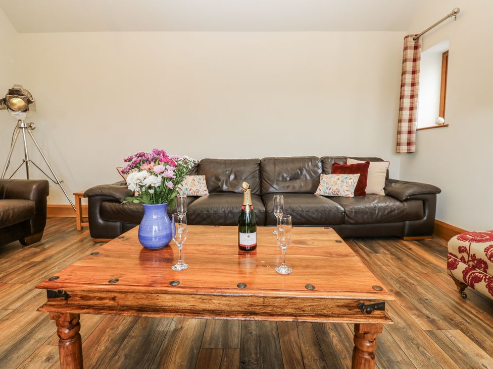A living room with a sofa and coffee table at Jacob's Lodge in Eggleston