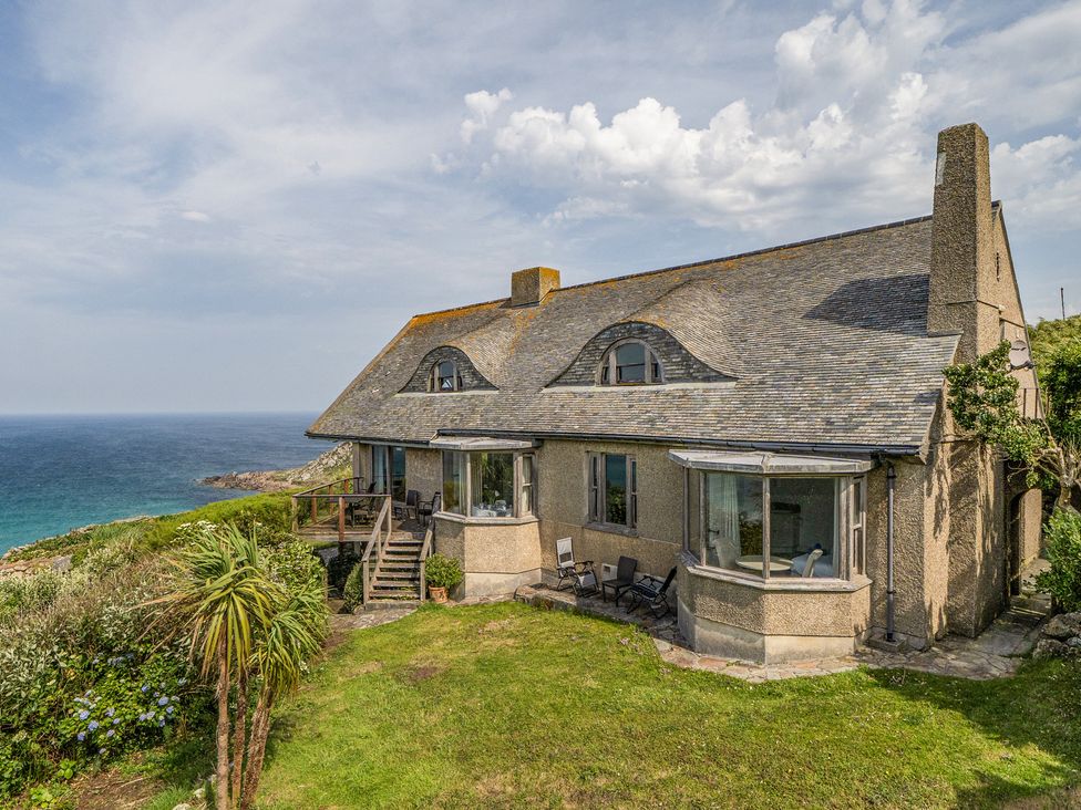 A house with a garden and deck overlooking the sea at Cragford Sennen Cove
