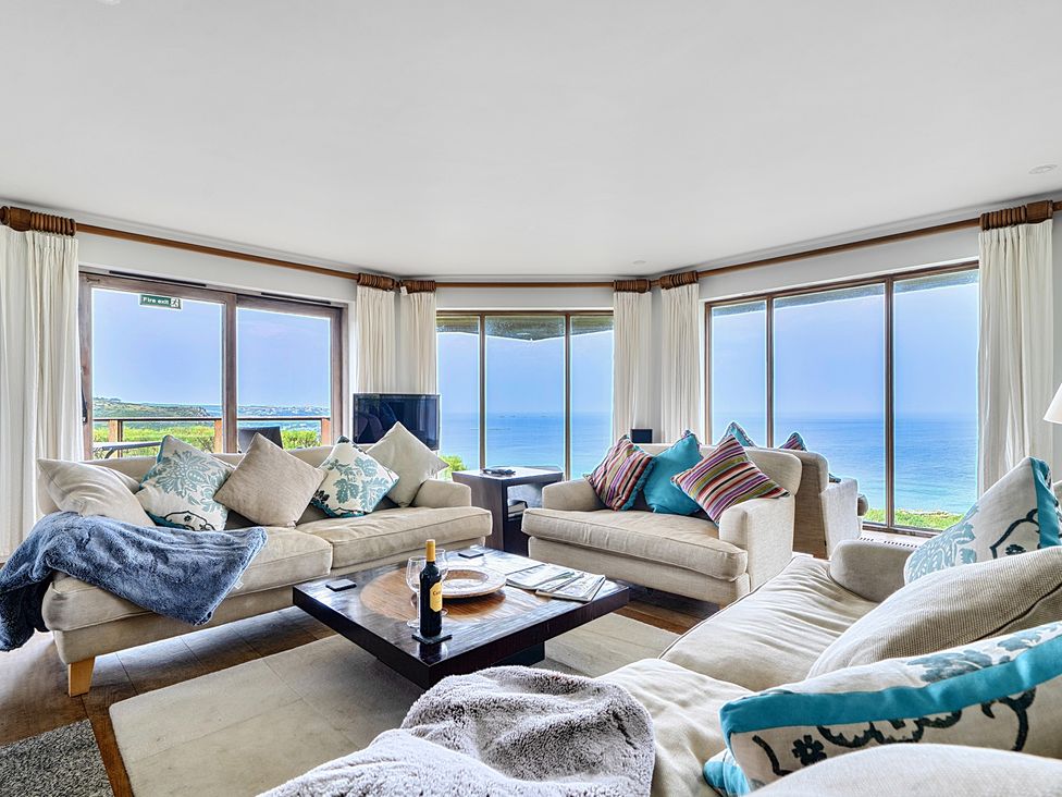 A living room with sofas and a coffee table at Cragford in Sennen Cove