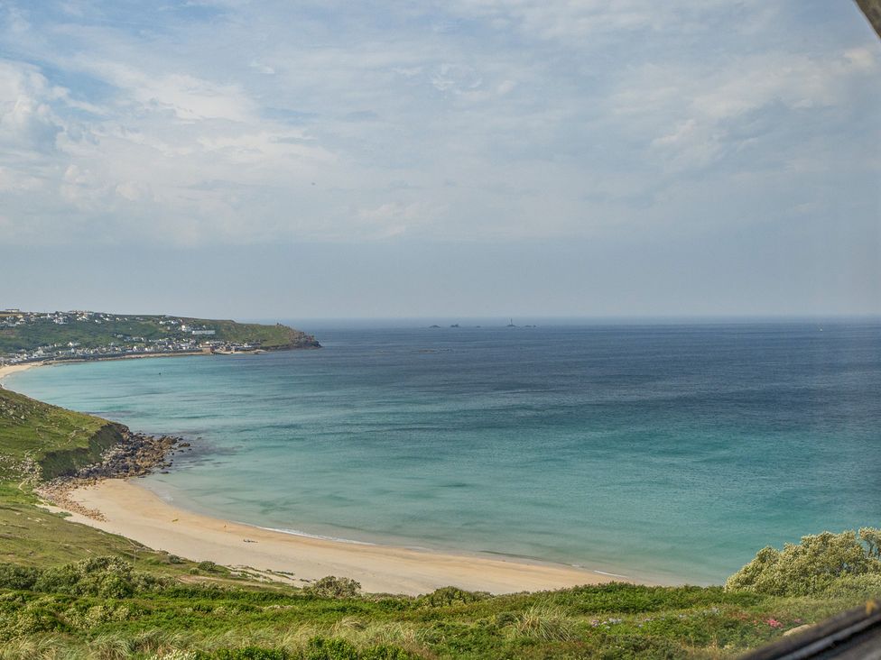 A coastal view with beach and sea at Cragford in Sennen Cove