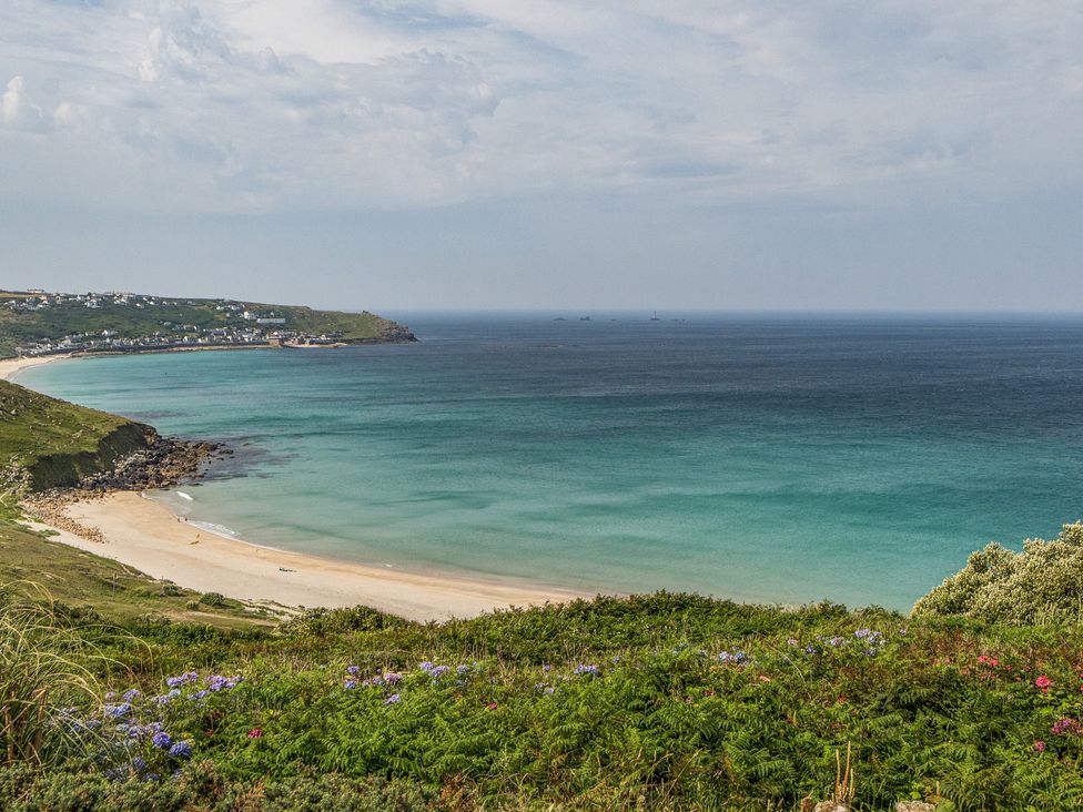 A beach with ocean and hills at Cragford in Sennen Cove