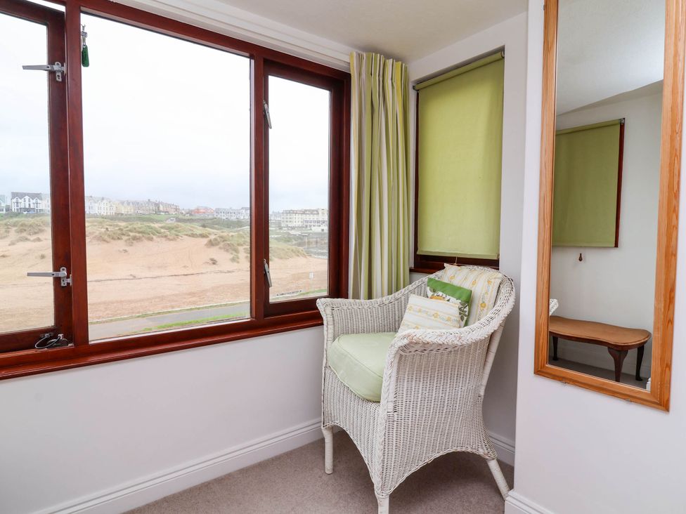 A snug with windows overlooking the beach at The Fort in Bude