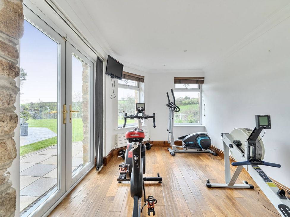 A gym with exercise equipment at Chapel Green Studio 2 in Polgooth