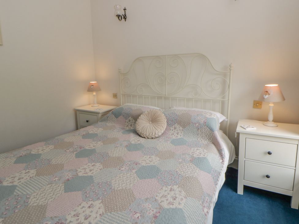 A bedroom with a bed and bedside tables at Teifi House near Cilgerran Cardigan