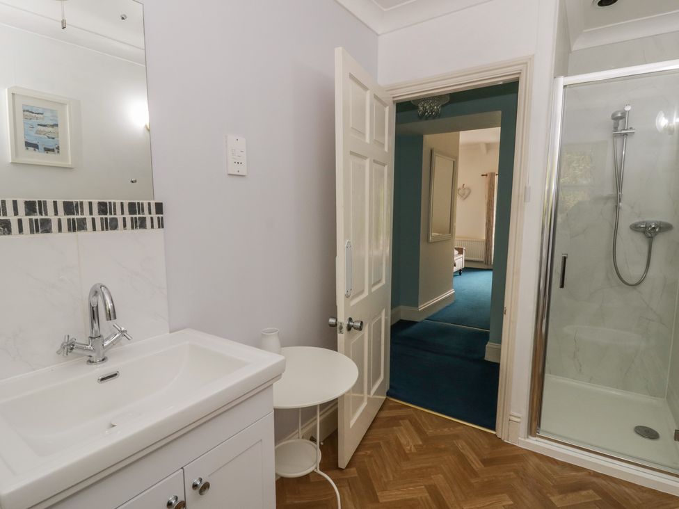 A bathroom with a sink and shower at Teifi House in Cilgerran near Cardigan