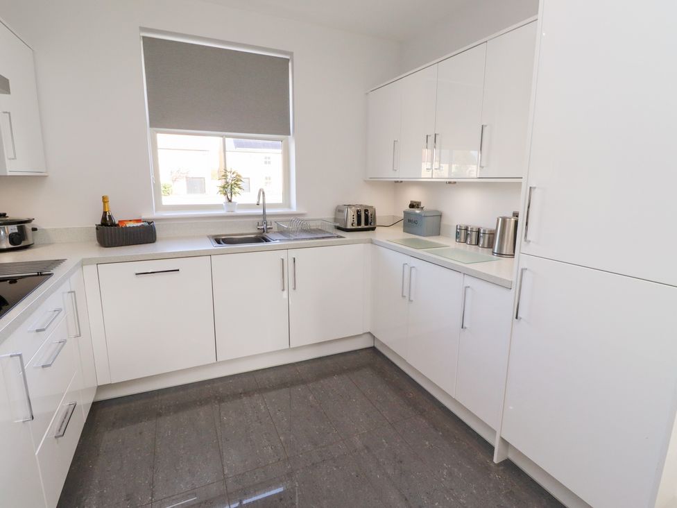 A kitchen with a sink and appliances at The Haven in Embleton
