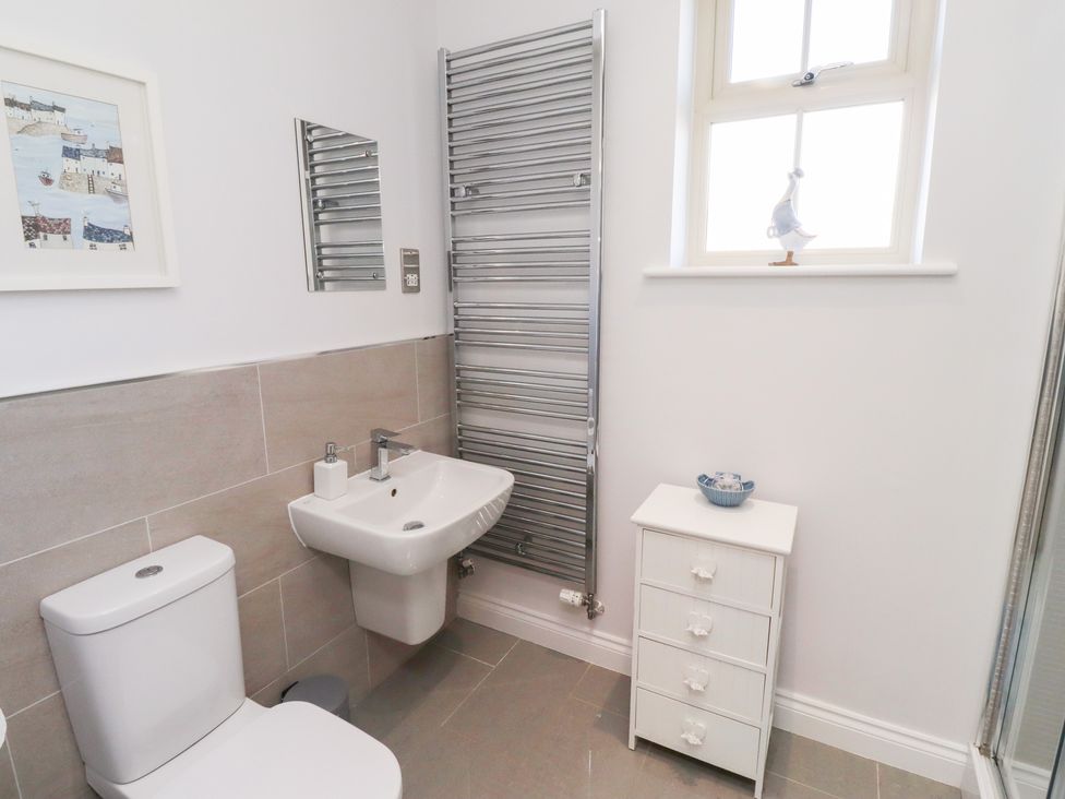 A bathroom with a sink and toilet at The Haven in Embleton