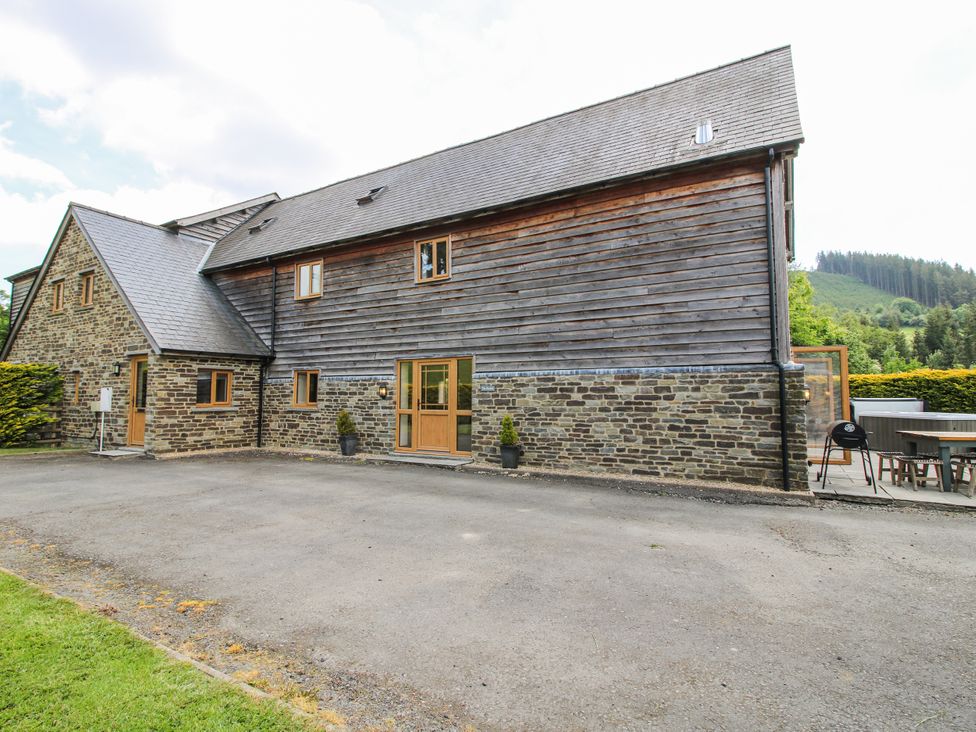 A house with windows and a driveway at The Hayloft in Bleddfa near Knighton
