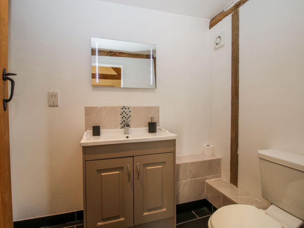 A bathroom with a sink and toilet at The Hayloft in Bleddfa near Knighton