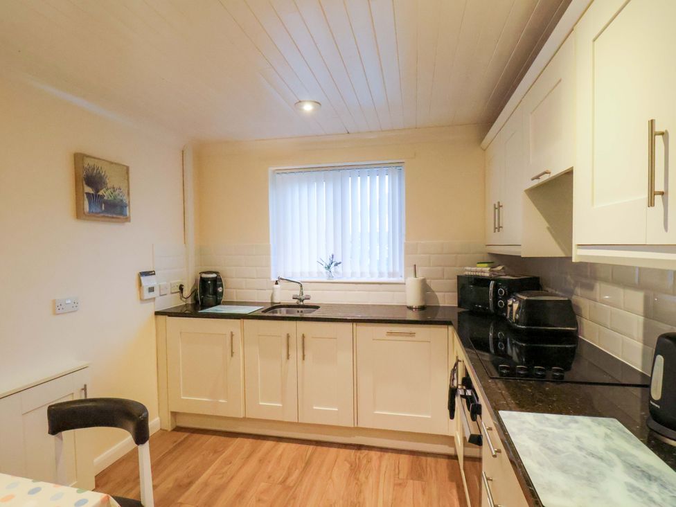 A kitchen with cabinets and appliances at La Rochelle in Whitby