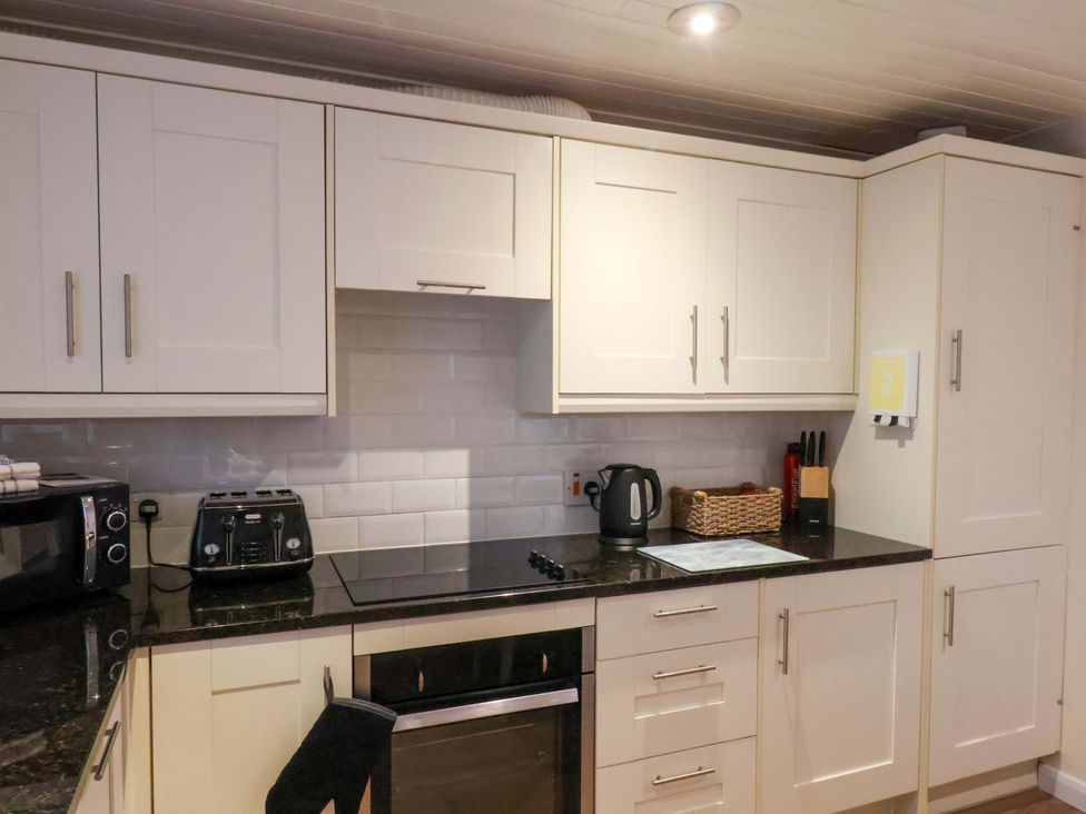 A kitchen with cabinets and appliances at La Rochelle in Whitby