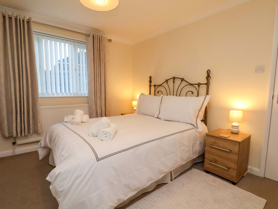 A bedroom with a bed and bedside table at La Rochelle in Whitby