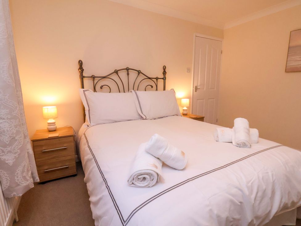 A bedroom with a bed and bedside table at La Rochelle in Whitby