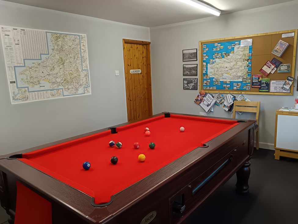 A pool table with balls in an activity room at Kingfisher in Blaenwaun