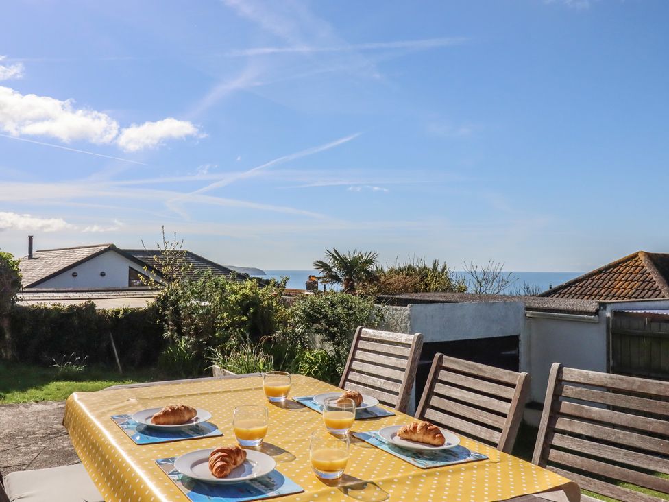 A table set with food and drinks in the garden at Highdown in Bigbury on Sea near Modbury