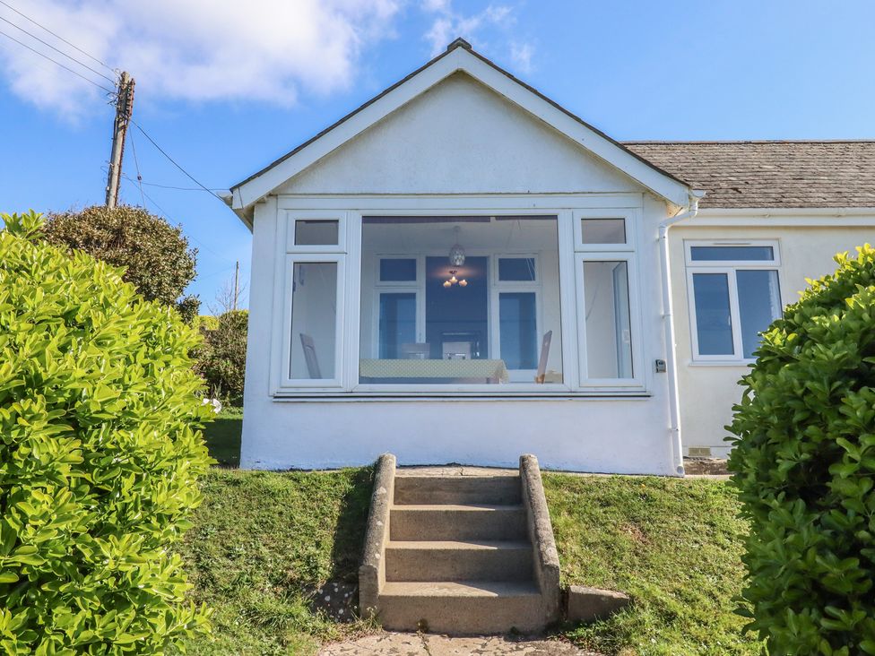 A house with steps leading to the entrance at Highdown in Bigbury on Sea near Modbury