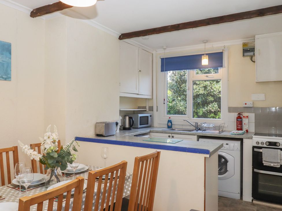A kitchen with dining area at Highdown Bigbury on Sea near Modbury