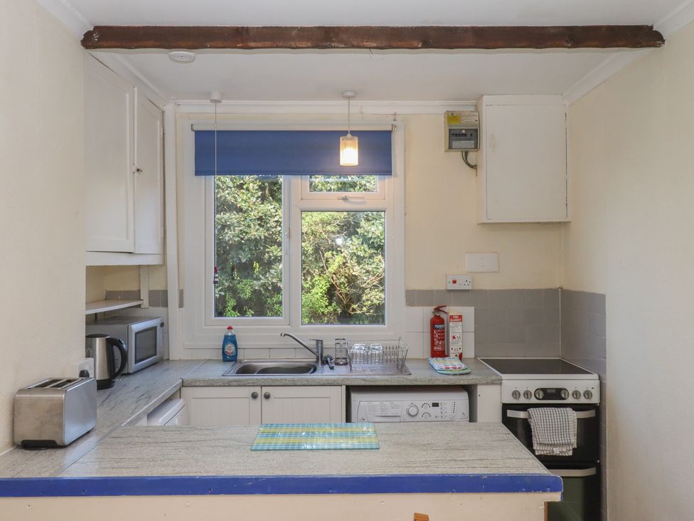 A kitchen with appliances and a sink at Highdown Bigbury on Sea near Modbury