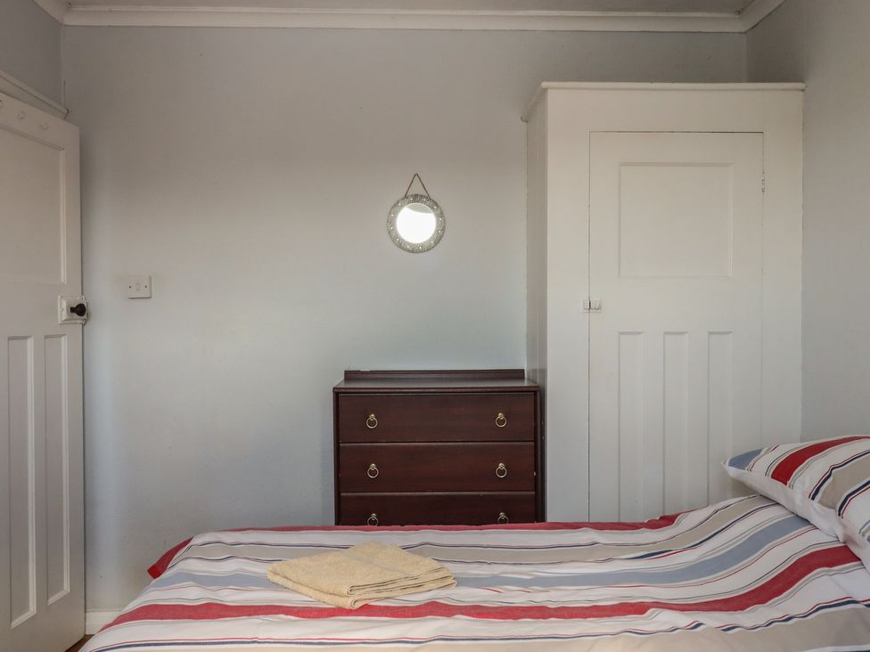 A bedroom with a bed and chest of drawers at Highdown Bigbury on Sea near Modbury