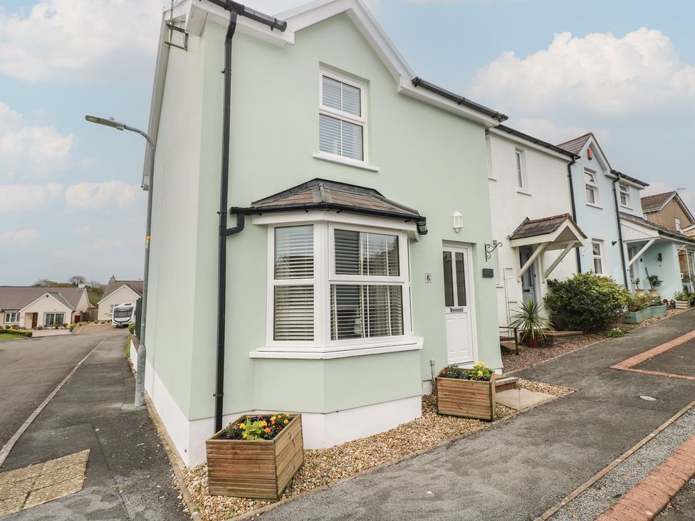 An exterior view of a house with a planter at Sandyhill House in Saundersfoot