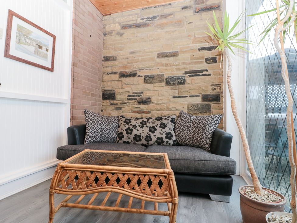 A snug area with a sofa and coffee table at Seacrest Lodge in Scarborough