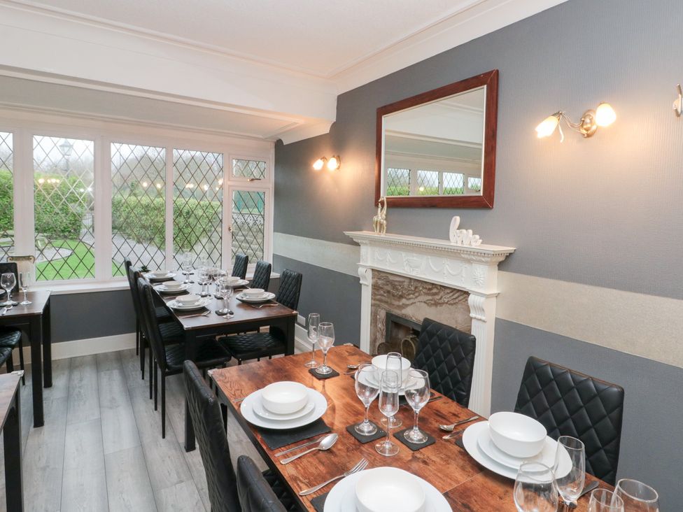 A dining room with a table set for dinner at Seacrest Lodge in Scarborough