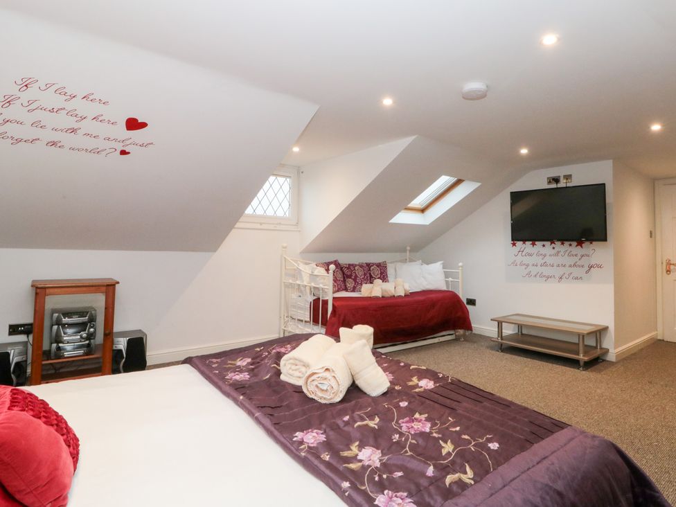 A bedroom with a bed and sofa bed at Seacrest Lodge in Scarborough