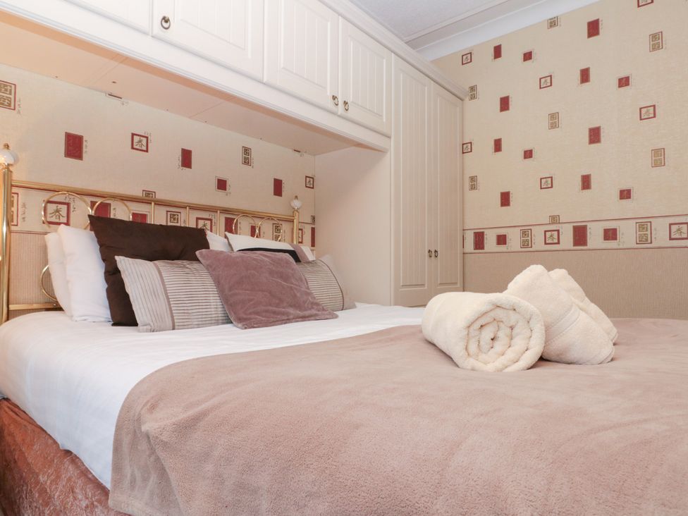 A bedroom with a bed and pillows at Seacrest Lodge in Scarborough