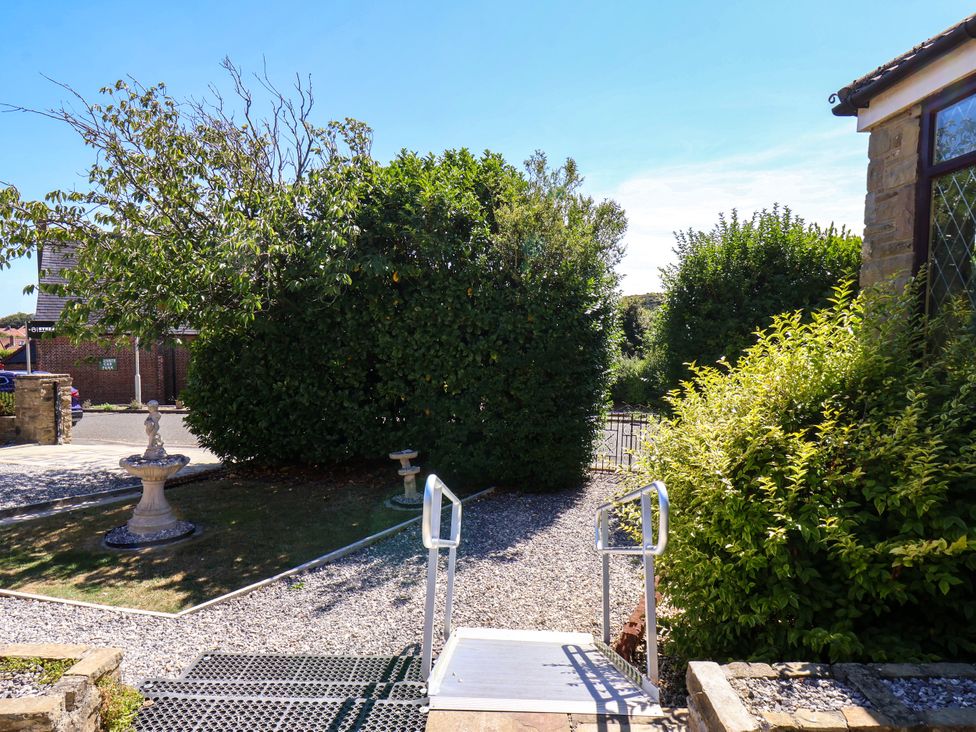 A garden with a ramp and fountain at Seacrest Lodge Scarborough