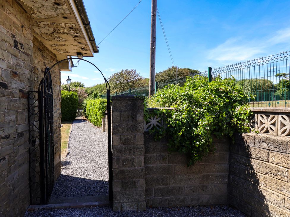 A garden path leading through an archway at Seacrest Lodge, Scarborough