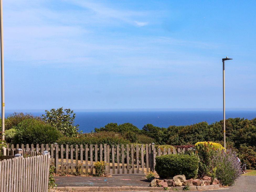 A view of the ocean and vegetation at Seacrest Lodge in Scarborough