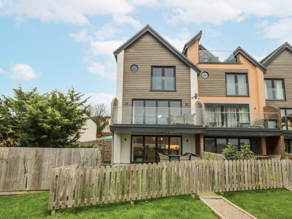 A house with a balcony and garden at Estuary View in Colwyn Bay