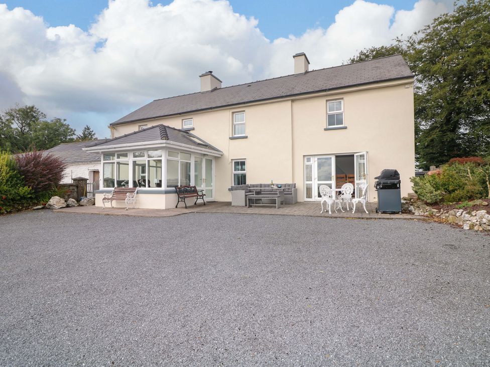 A house with a patio and outdoor furniture at Curradoon House in Touraneena, County Waterford