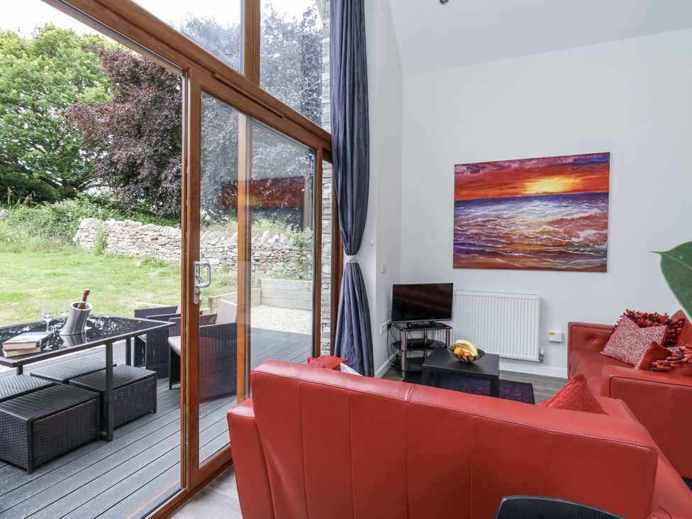 A living room with a window and seating at Budmouth in Upwey near Weymouth