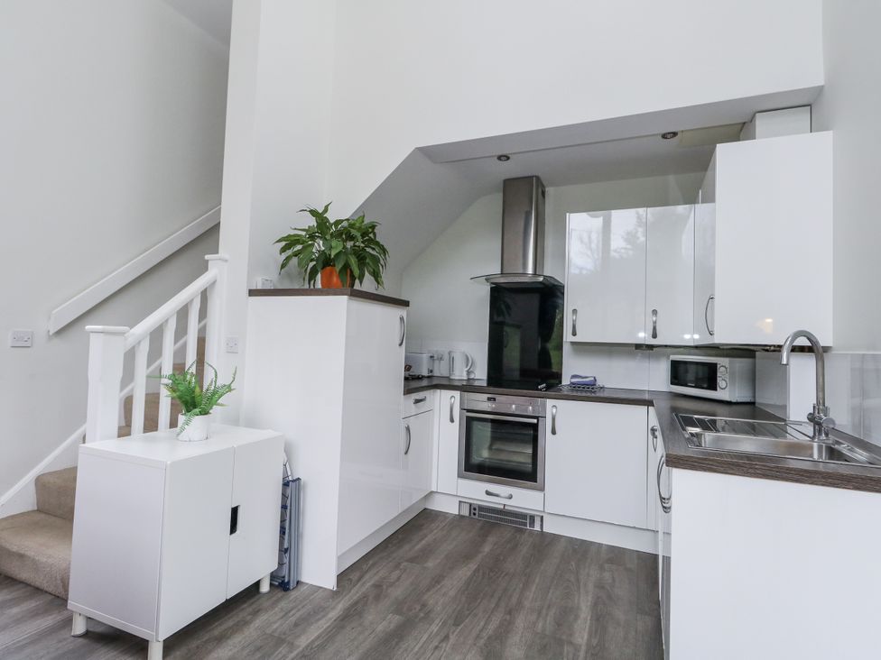 A kitchen with cabinets and appliances at Budmouth Upwey near Weymouth